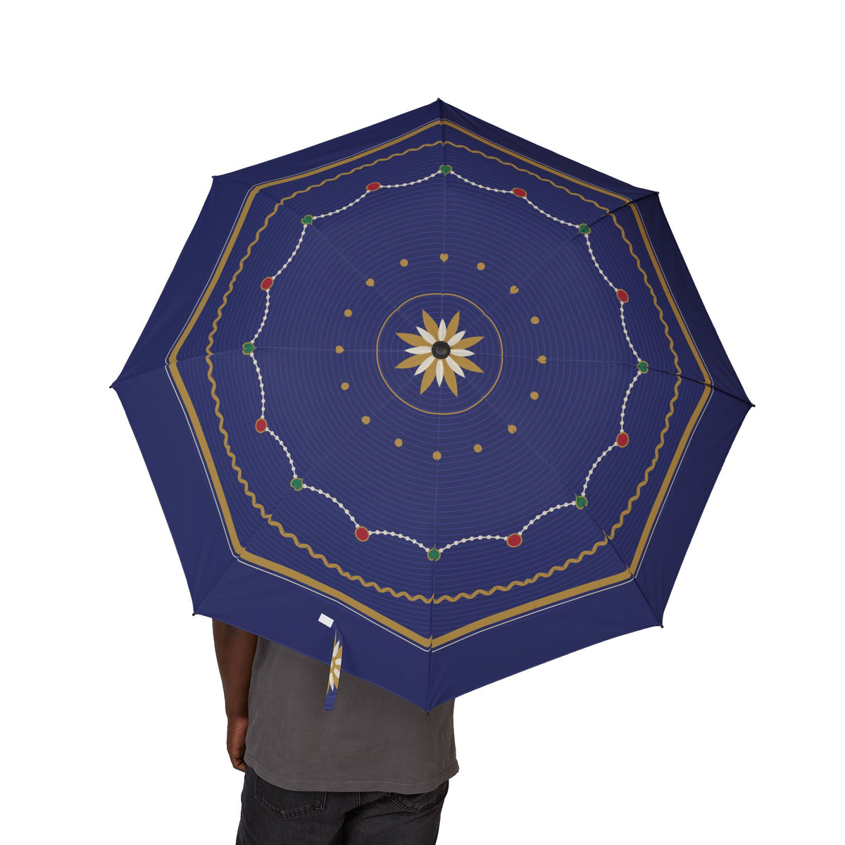 Person holding the Romanov imperial guilloché folding umbrella, canopy from above