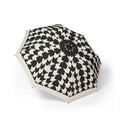 The Bernadotte houndstooth folding umbrella, open, seen from above